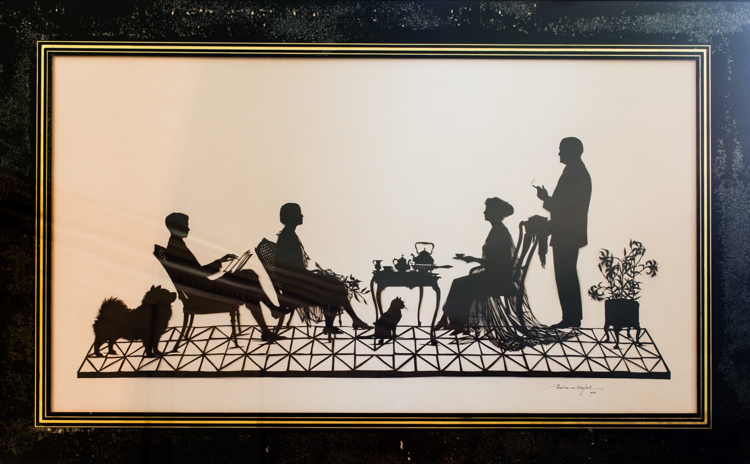 Interior details of wall decor featuring the Crane Family in Silhouette at the Great House of the Crane Estate