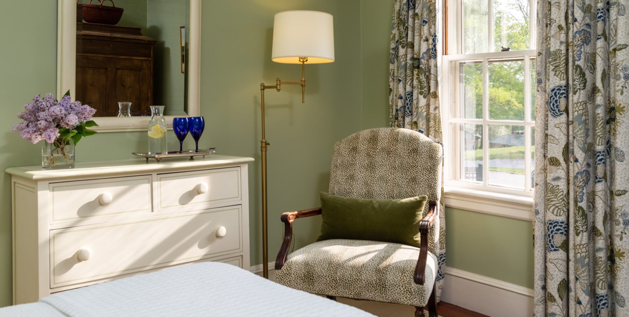 Reading chair by window in Choate Room at The Inn at Castle Hill