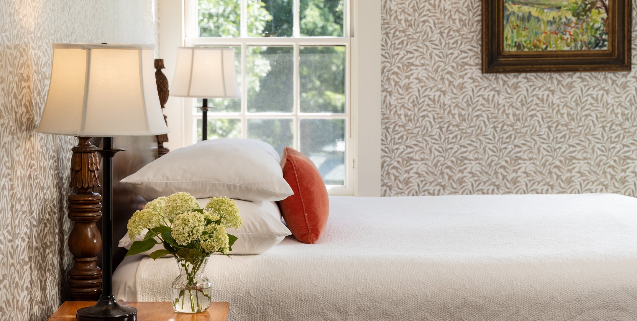 Bed and window views in Brown Room at The Inn at Castle Hill