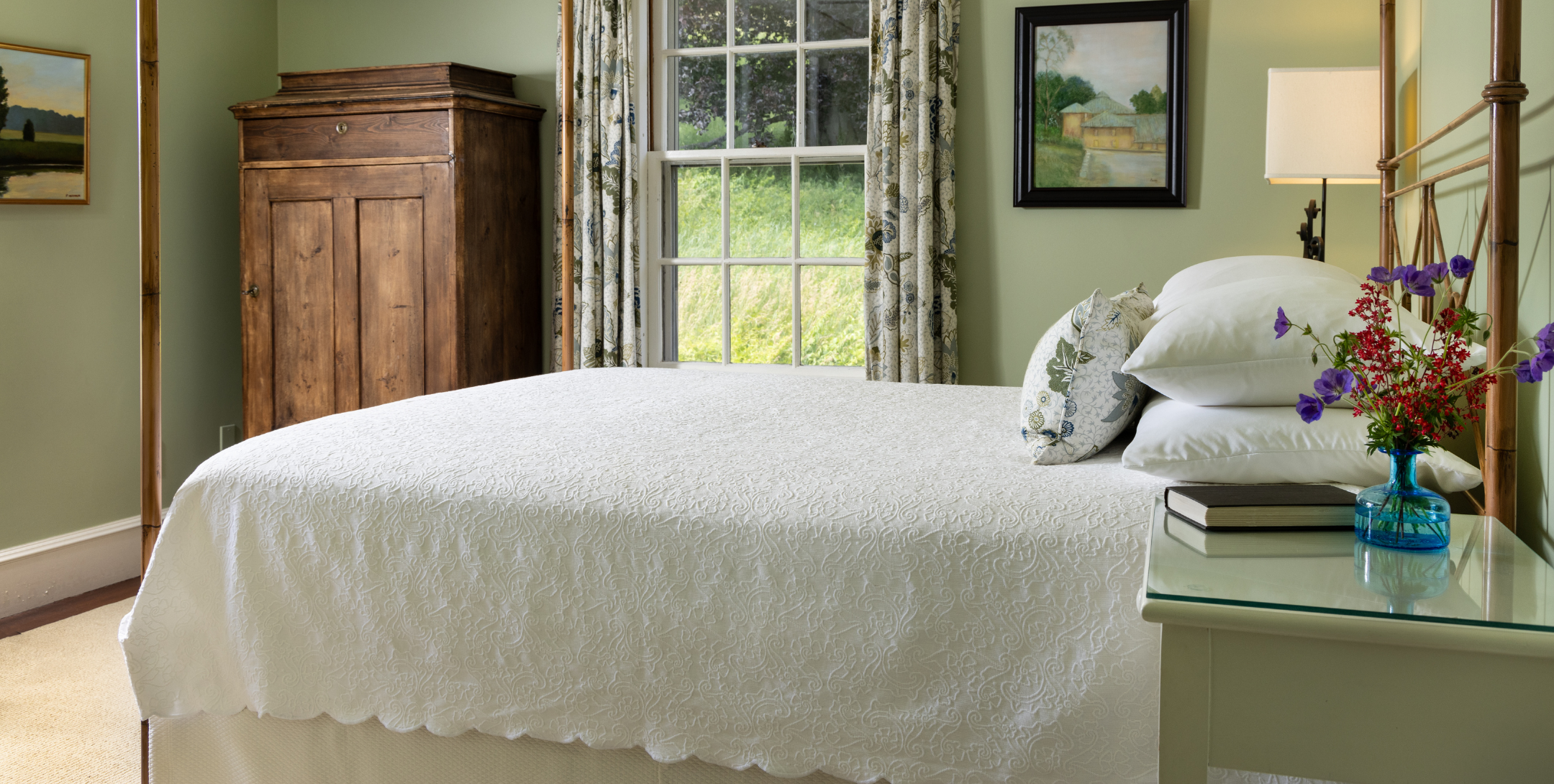 Bed and lilacs in Choate Room offering one of the best places to stay in Massachusetts